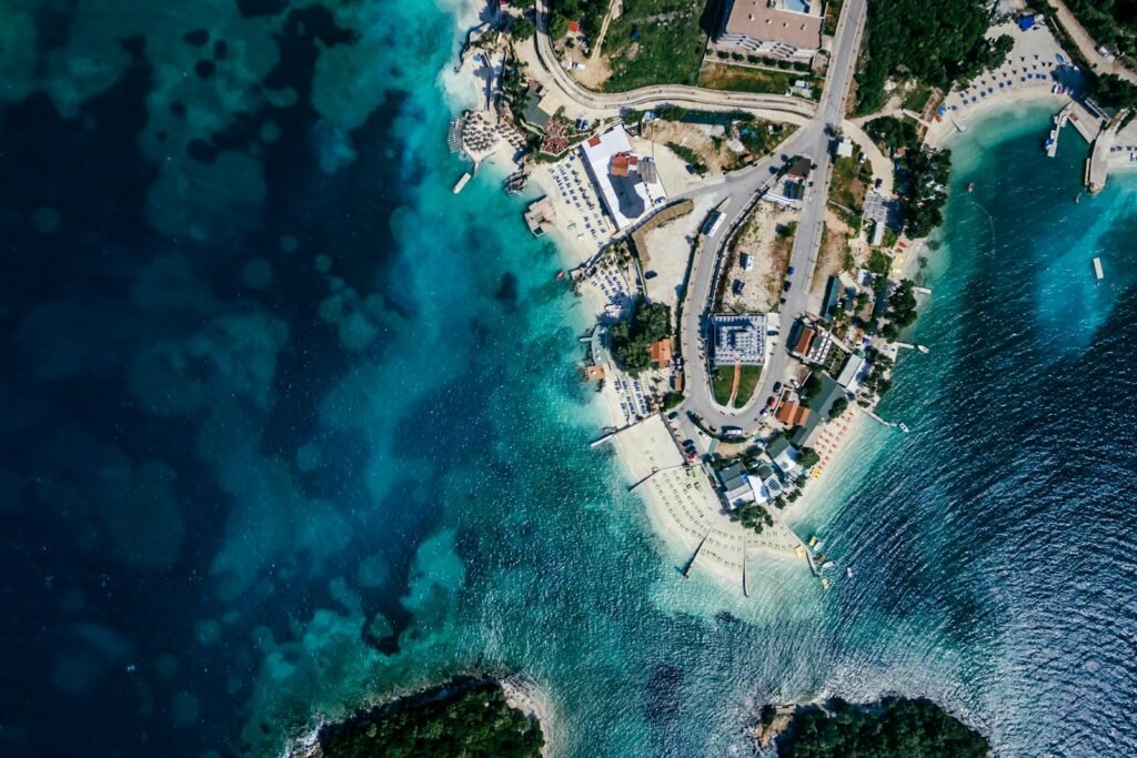 Aerial view of the Ksamil coastline and its clear Ionian Sea water