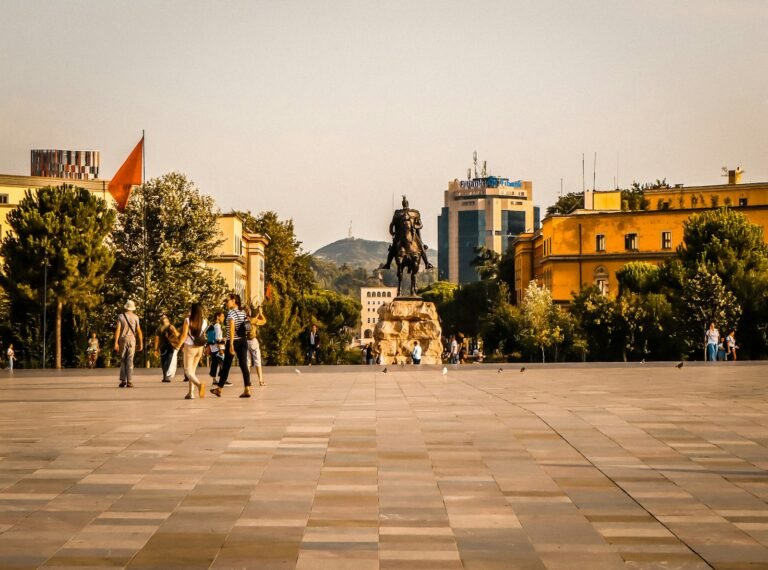 People walking across Skanderbeg Square in central Tirana
