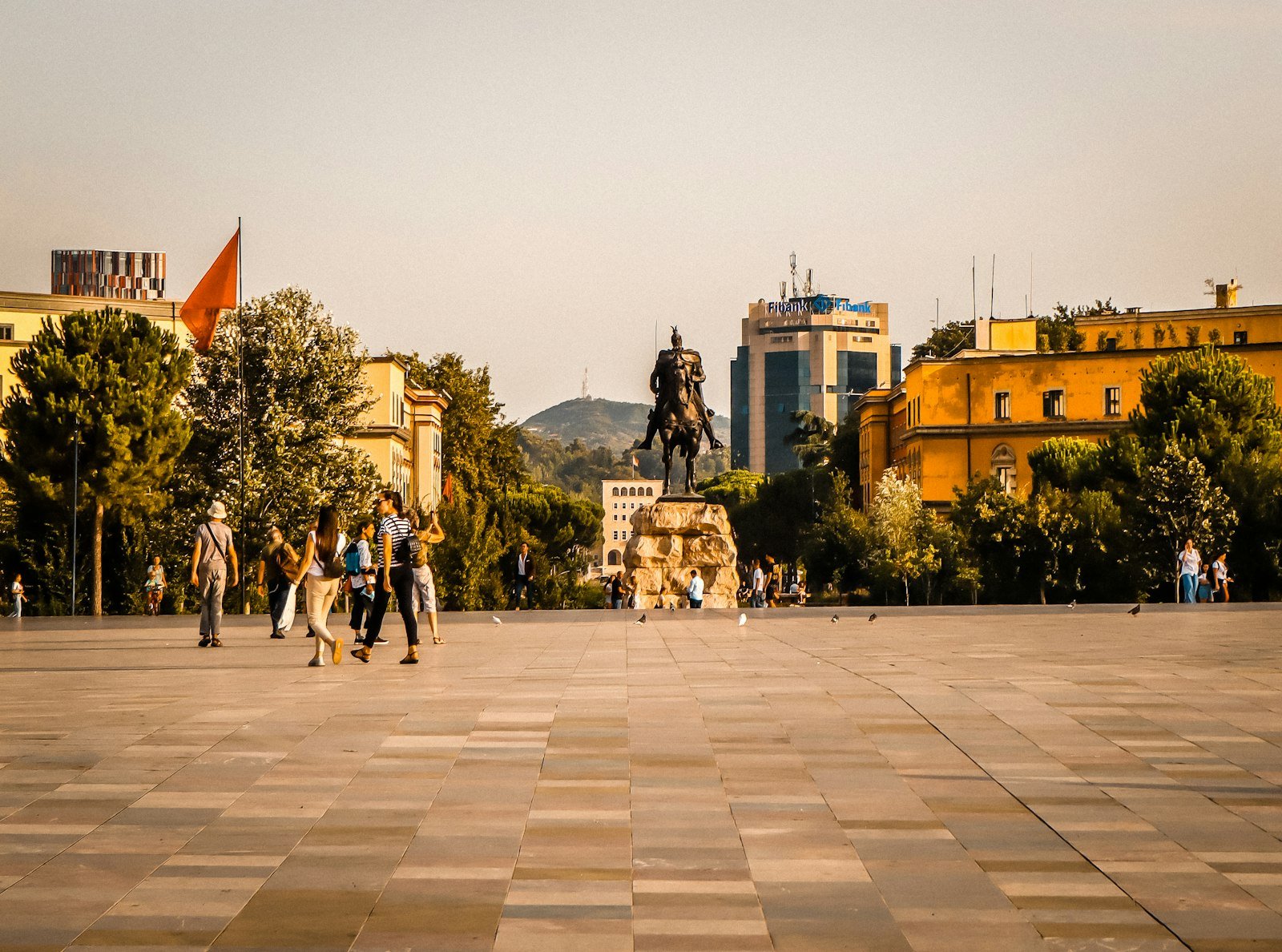 People walking across Skanderbeg Square in central Tirana